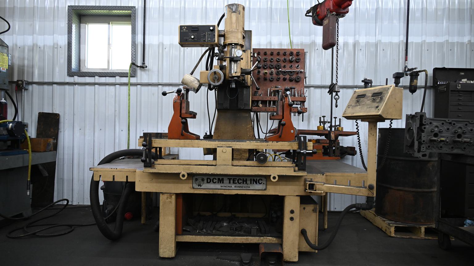 A surfacing machine and its tooling rack on the shop floor at PDM in Sidney, Ohio.