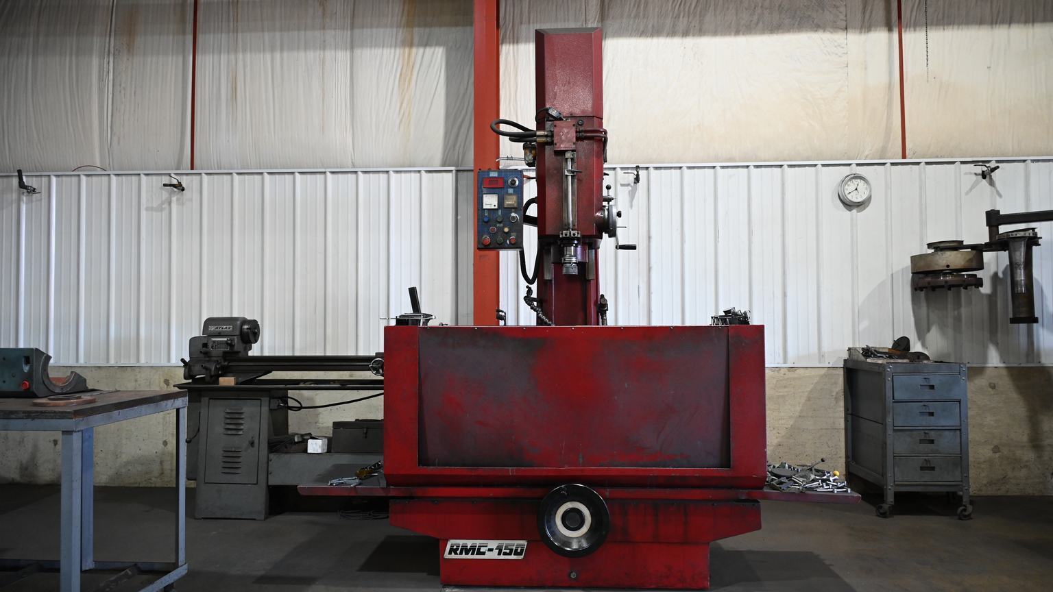 A vertical boring machine marked RMC-150 standing on the shop floor at PDM.