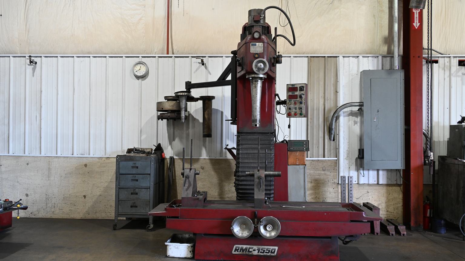 PDM's RMC 1550 vertical boring machine, with its tool head and table, on the shop floor.