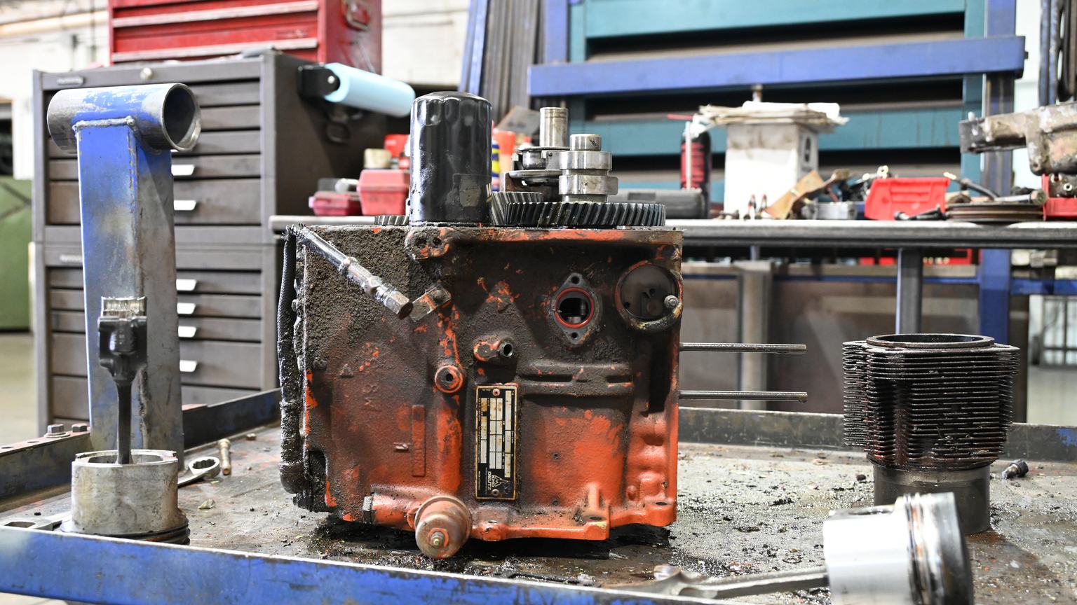 A greasy engine block as received at PDM, on the bench before cleaning.